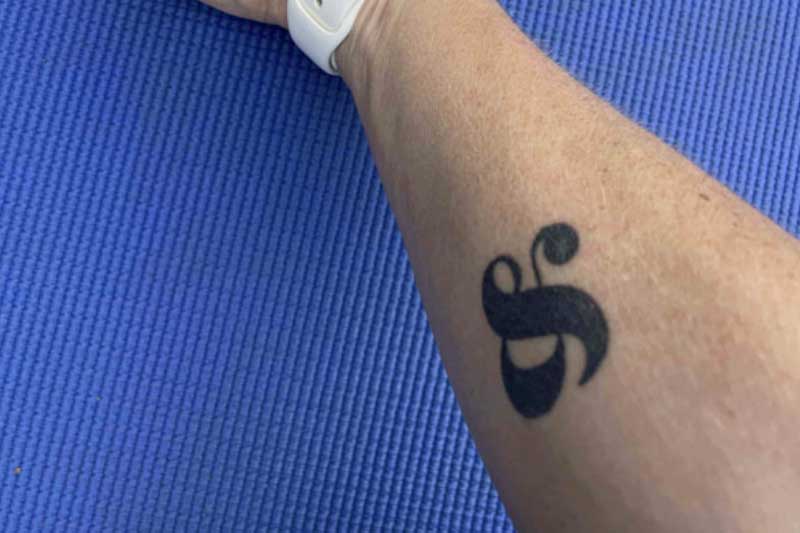 & Symbol Tattoo on a arm