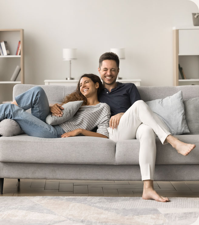Sex Therapy - couple cuddling on the couch, man and woman