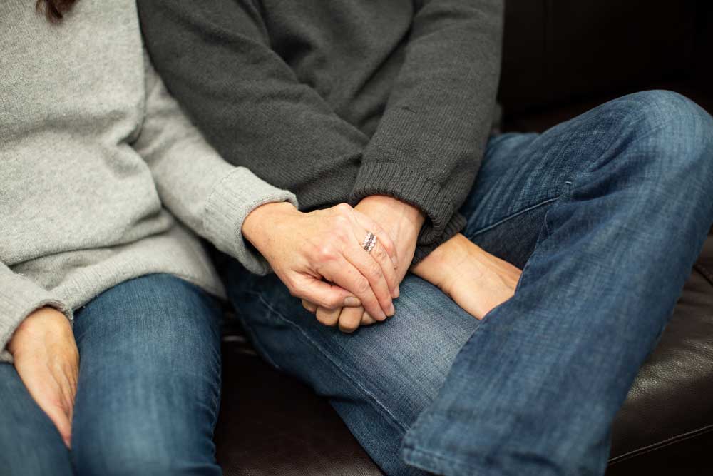 Couple holding hands